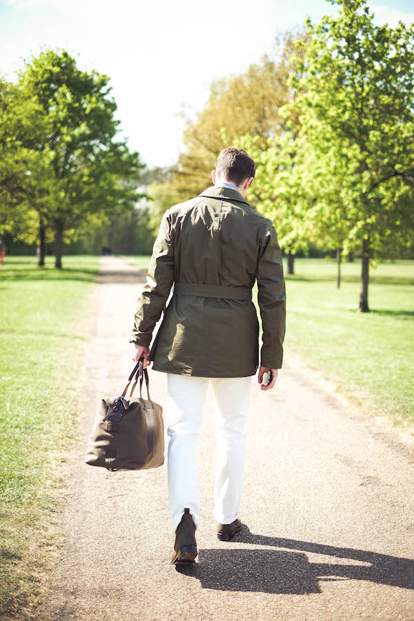 Shooter Jacket by Grenfell x The Rake; powder blue denim shirt, Drake’s for The Rake; grey roll neck, Sunspel; white jeans, Dunhill; Chelsea boots, Crockett & Jones; bag, Troubabdour; sunglasses, watch and ring property of the stylist.