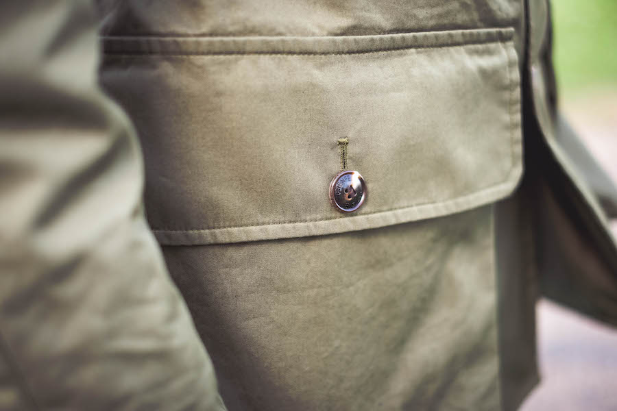 Shooter Jacket by Grenfell x The Rake; powder blue denim shirt, Drake’s for The Rake; grey roll neck, Sunspel; white jeans, Dunhill; Chelsea boots, Crockett & Jones; bag, Troubabdour; sunglasses, watch and ring property of the stylist.