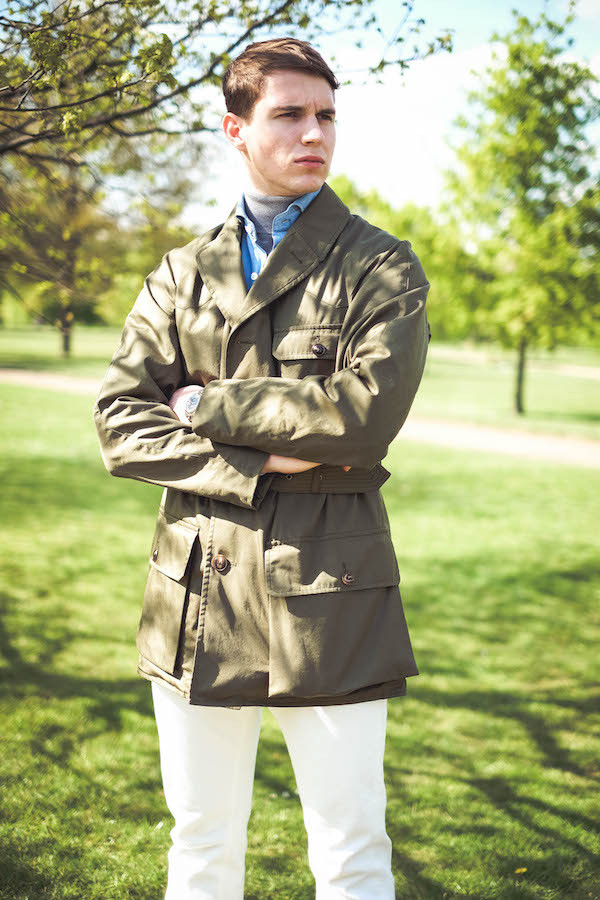 Shooter Jacket by Grenfell x The Rake; powder blue denim shirt, Drake’s for The Rake; grey roll neck, Sunspel; white jeans, Dunhill; Chelsea boots, Crockett & Jones; bag, Troubabdour; sunglasses, watch and ring property of the stylist.