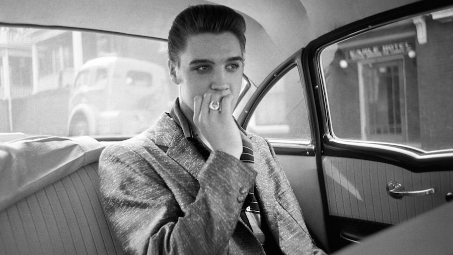 Looking pensive with a slub wool blazer and striped polo shirt combination, circa 1950s.