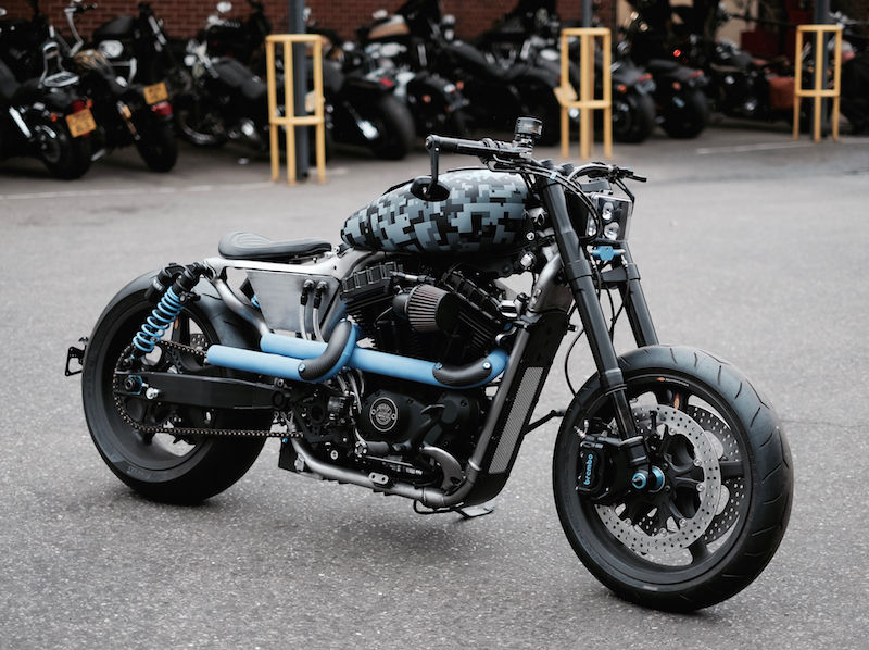 The custom Sportster replete with grey/blue camouflage paint and blue ceramic-coated exhaust.