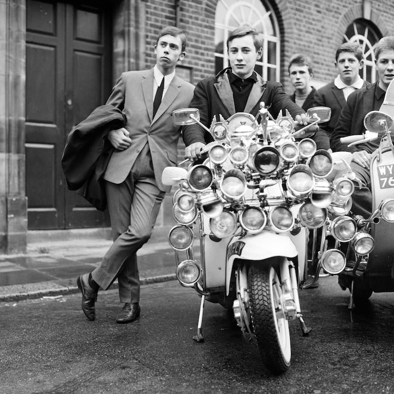 Mods and their elaborate scooters in Peckham, London, 1964. Photo by © Daily Mirror/Mirrorpix/Corbis.