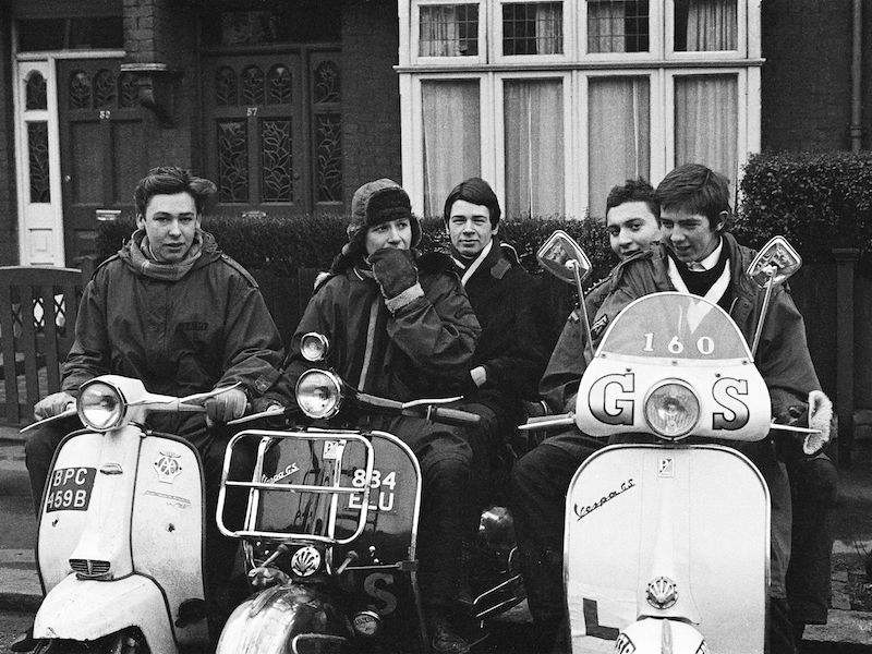 Teenage mods in parkas, on their Vespa scooters, London 1964. Photo by Peter Francis/PYMCA/REX/Shutterstock.