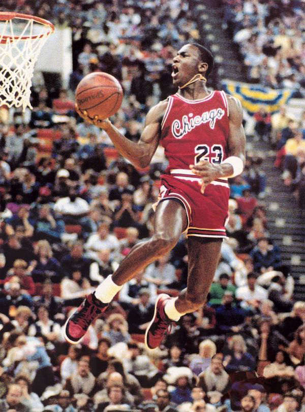 Michael Jordan competing in the NBA Slam Dunk Competition, 1985.