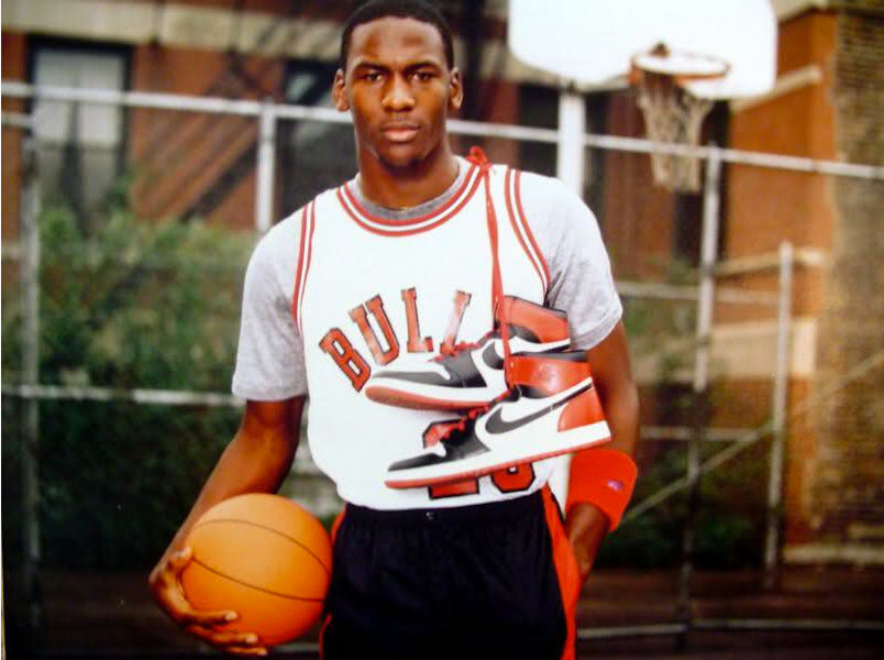 Michael Jordan holding Air Jordan 1 trainers for his Nike campaign, 1985.