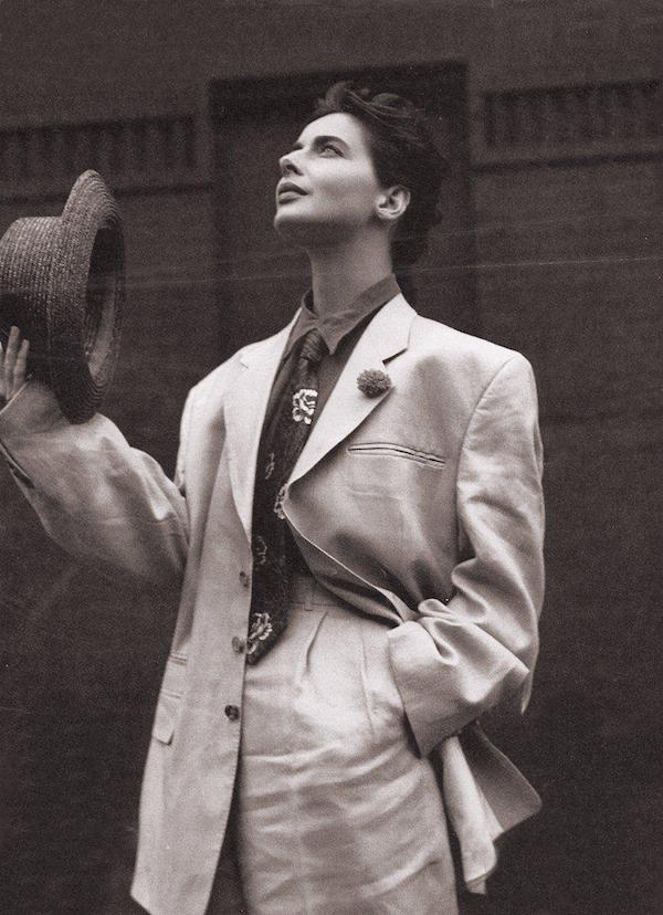 Rossellini poses in an androgynous trouser suit and her signature short hair style, circa 1990.