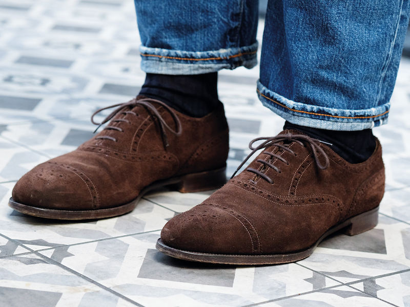 “Edward Green is by far my favourite shoemaker. I find Italian and French shoes too long,” Alessandro tells me. He wears a bespoke model that’s crafted on Edward Green’s 202 last and that pops with his heavily distressed five-year-old Fortela jeans.