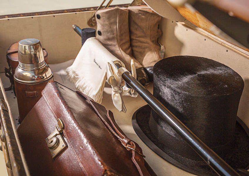 A Louis Vuitton motoring trunk complete with top hat, white bow-tie, cuff and collar boxes, a scarf from Turnbull & Asser, and dancing and tap shoes.