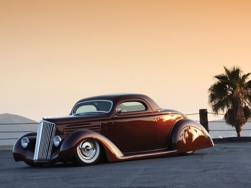 The 1935 Ford Coupe “Ruby Deluxe” features hand-made rear fenders and skirts, bonnet and dashboard and was awarded the 2011 Good Guys “Kustom of the Year” award.