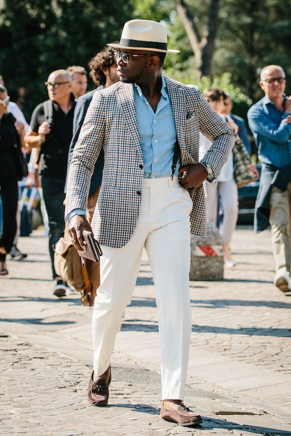 Clip-on braces are utilised subtly here under the check sport coat. The rakish addition of the Panama hat and Belgian loafers are well executed, too.