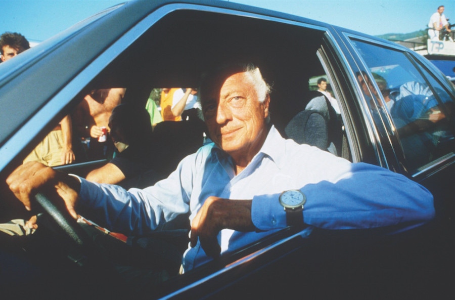 Agnelli, displaying his usual effortless style behind the wheel of one of his many automobiles, circa 1960s. Photo by Agenzia Contrasto/REX