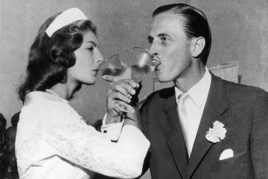 Newlyweds Baroness Fiona von Thyssen and Hans Heinrich toasting in Castagnola, 1956. Photo by Keystone/Getty Images.