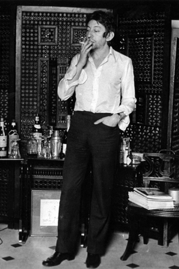 This look epitomises his nonchalant attitude with undone cuffs and cigarette in hand, circa 1967.