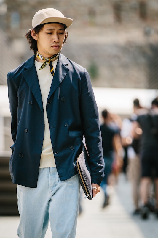 An example of the looser silhouette prevalent in menswear currently. Wide-legged, stone-washed jeans are combined with an unstructured double-breasted blazer, loopback sweatshirt, neckerchief and five-panel cap.