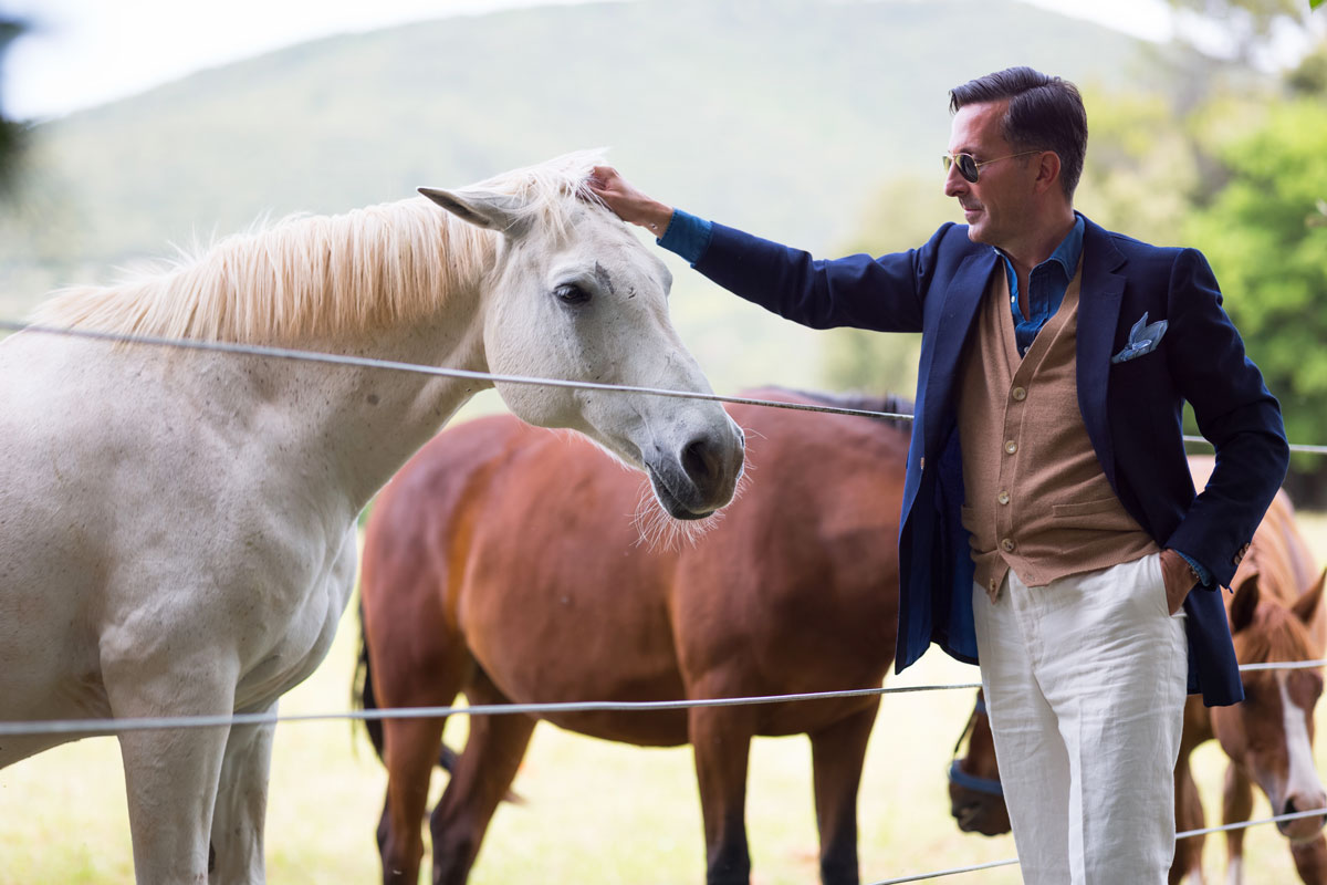 Alexander Kraft wears bespoke Cifonelli.