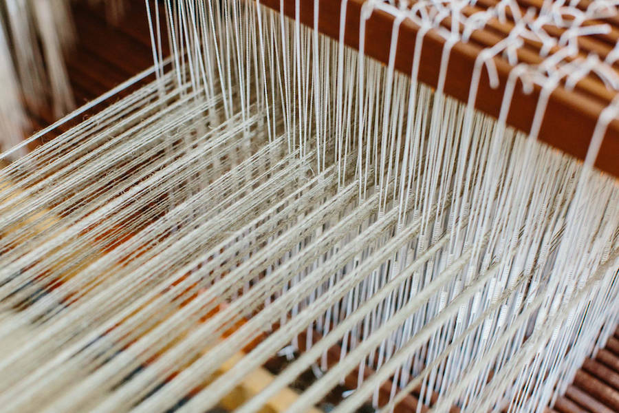 Linen being delicately woven.