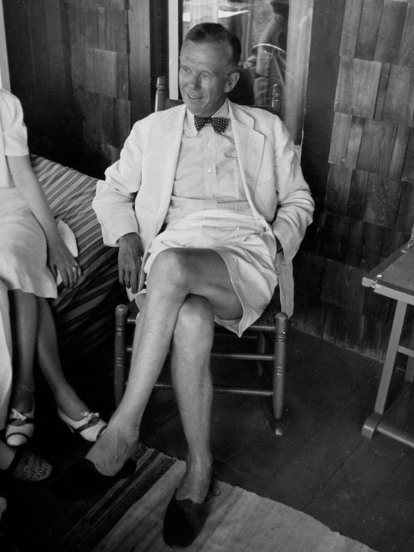 General George C. Marshall wearing Bermuda shorts, a linen sports coat, bow tie and no socks on the porch of his summer cottage at Fire Island, New York, 1939.