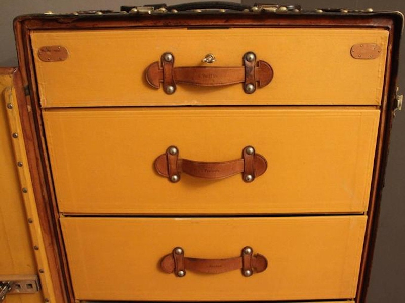 Six leather lined drawers leave plenty of room for foldable garments.