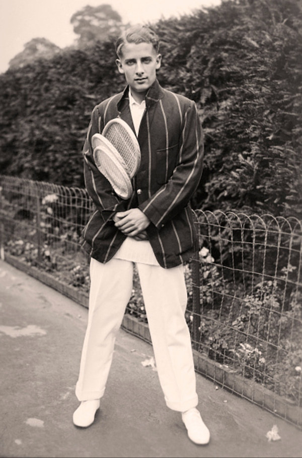 Bunny Austin in a striped sports jacket and whites, ready for a game in 1931. A year later he wore shorts at Forest Hills, and later went on to be the first player to wear shorts at Wimbledon.