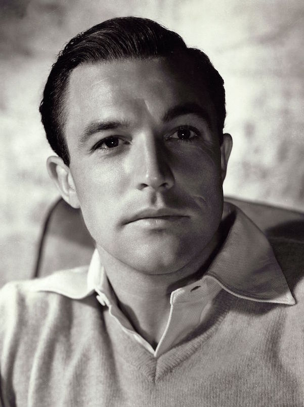 Wearing a piqué weave shirt with a long, pointed collar beneath soft knitwear, 1945. Photo by Clarence Sinclair Bull/Kobal/REX/Shutterstock.