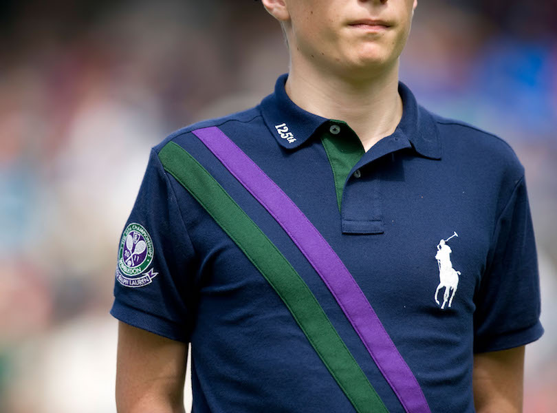 Polo Ralph Lauren ball boy shirt detail during the 2011 championships with the signature logo and green/purple stripe.