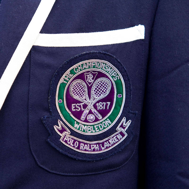 The Wimbledon logo embellished with 'Polo Ralph Lauren' on a linesman's blazer at the championships, 2011. Photo by Jeff Gilbert/Alamy.