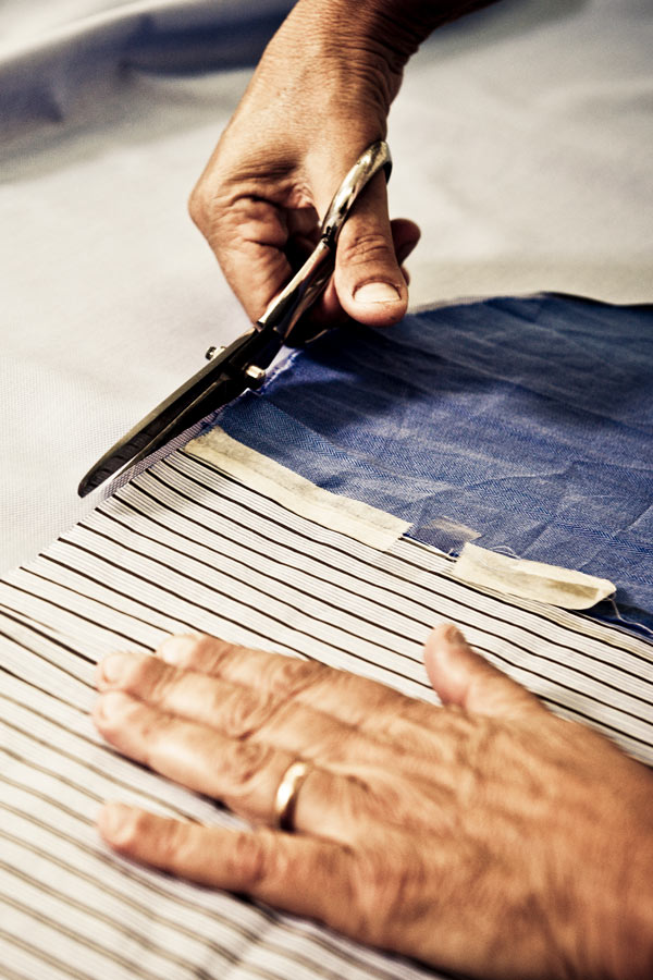 The hand-cutting of fabric in Santillo's atelier.