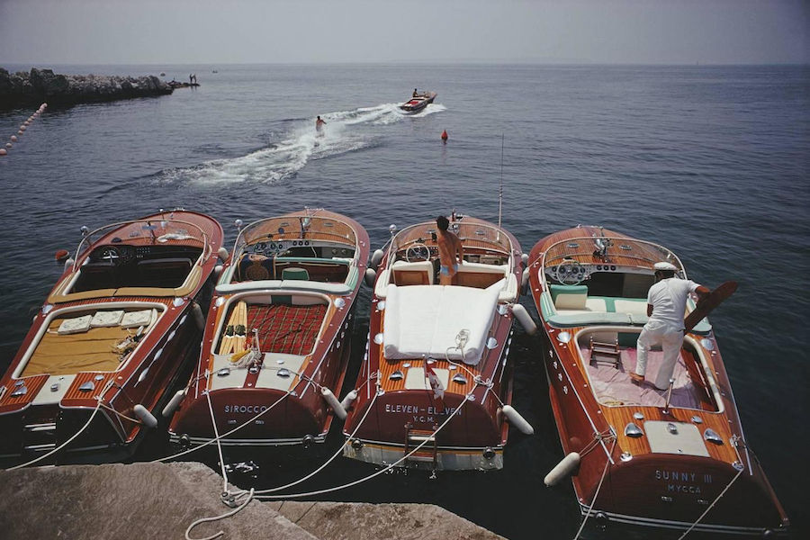 A lineup of Riva speedboats docked outside the Hôtel du Cap, 1969. Photo by Slim Aarons.