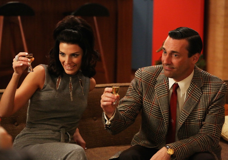 Don Draper toasts with his glamorous second wife Megan, wearing a bold Prince of Wales check jacket and monogrammed red tie. Throughout the series, he wears a series of vintage watches by Omega, Rolex and Jaeger-LeCoultre.