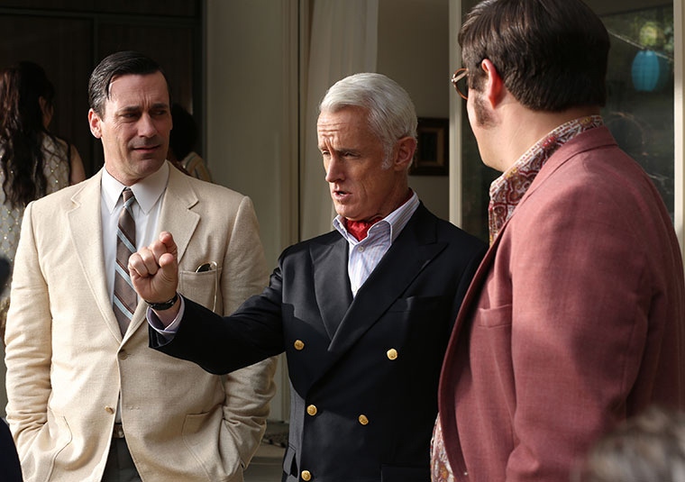 Roger Sterling’s nautical-inspired navy double-breasted blazer polished off with a rakish red neckerchief and a shock of white hair.