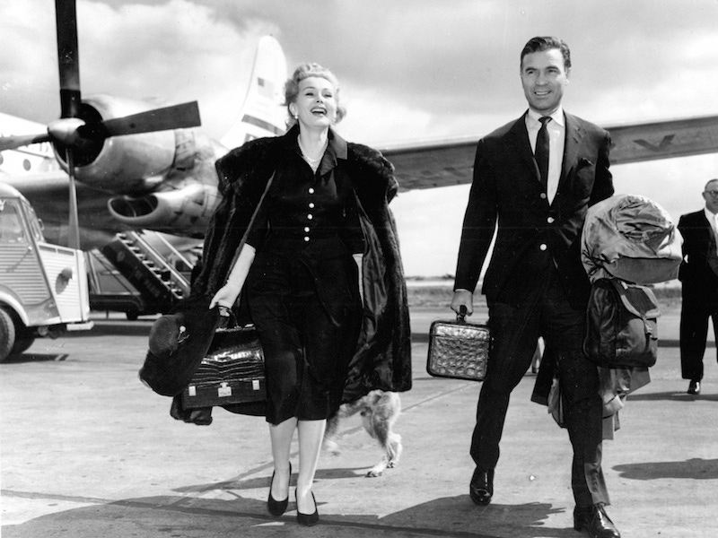 Porfirio Rubirosa and Zsa Zsa Gabor at Orly Airport on their way to the Cannes Film Festival in 1955.