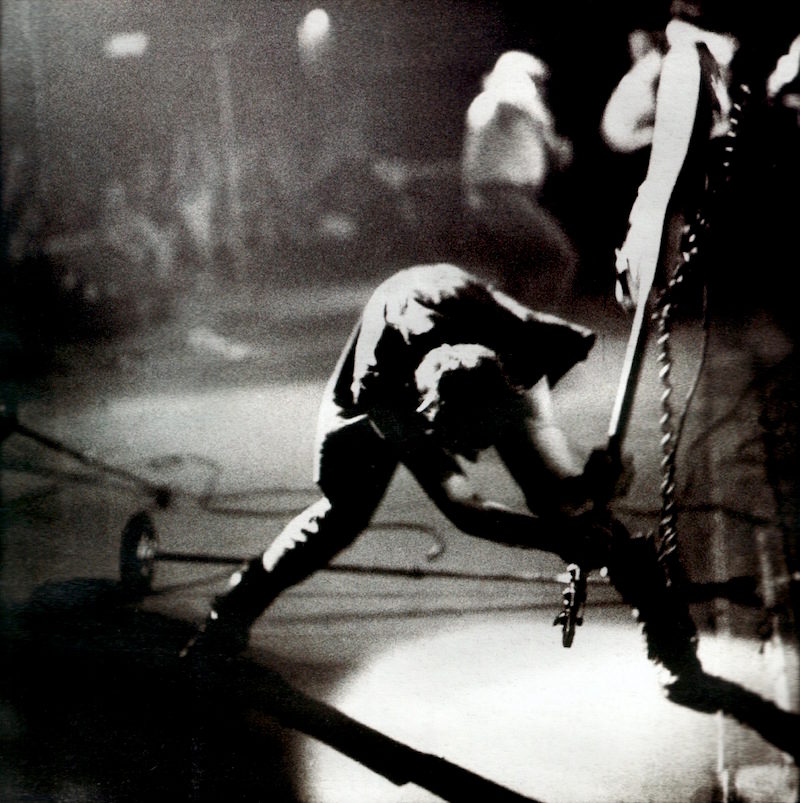 The iconic image of Simonon smashing his guitar, as captured by Pennie Smith in the late 1970s.