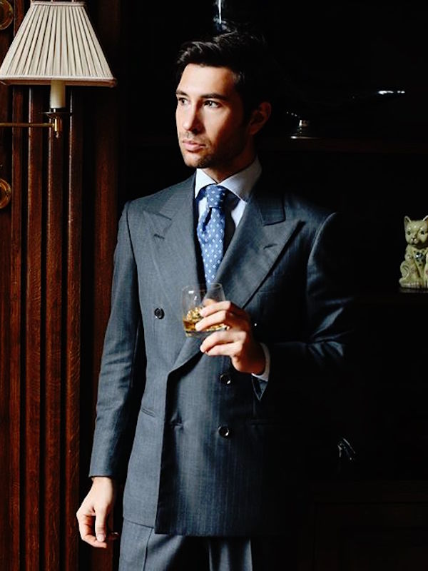 Filippo Fiora wearing a double-breasted A. Caraceni pinstriped suit in VBC wool.