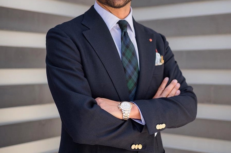 Giorgio Giangiulio takes a more subtle approach to the pattern, incorporating it into his accessories with a green and blue tartan tie.