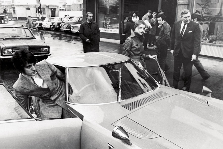 An 18-year-old Twiggy and Justin getting into her new Toyota 2000 GT sports car, a gift from the Japanese car company in 1968. Photo by Keystone/Hulton Archive/Getty Images.