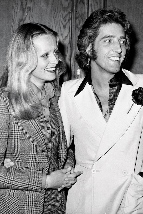 Twiggy with Justin de Villeneuve both wearing bespoke Nutter's of Savile Row suits at a press conference announcing their plans to produce musical film 'Gotta Sing, Gotta Dance', 1973. Photo by Ian Showell/Keystone/Getty Images.