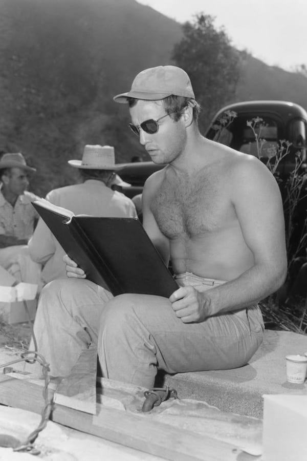 Brando goes over his script during location filming for Julius Caesar, 1953.