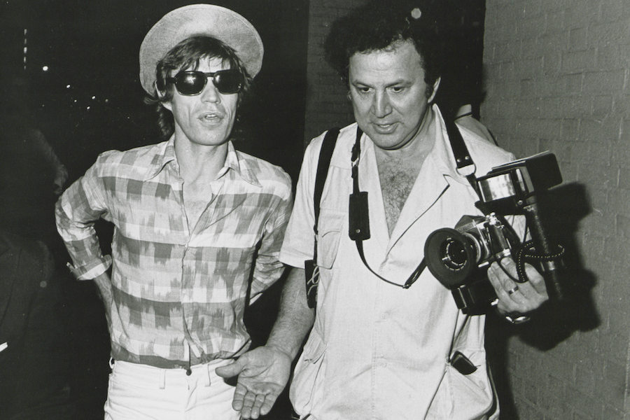 Mick Jagger and Ron Galella, circa 1982. Photo by The LIFE Picture Collection/Getty Images.