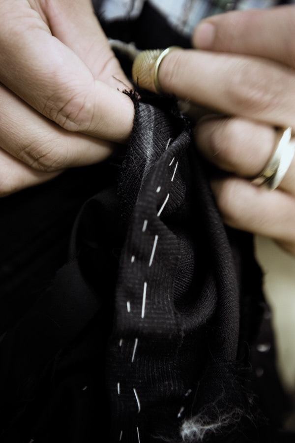 Hand-sewing together a suit in the brand’s workroom. Anderson & Sheppard apply the same techniques used for bespoke in their ready-to-wear collection.