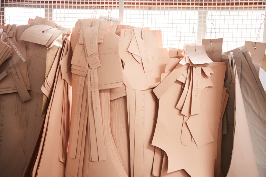 Paper patterns hanging in the workroom. Photo by Kim Lang.