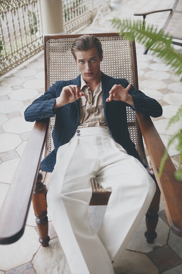 Jules Raynal wears navy and white stitch stripe cotton jacket, Caruso; beige short-sleeved cotton safari shirt, Moncler; ivory cotton trousers, Salvatore Ferragamo. Originally published in Issue 51 of The Rake.