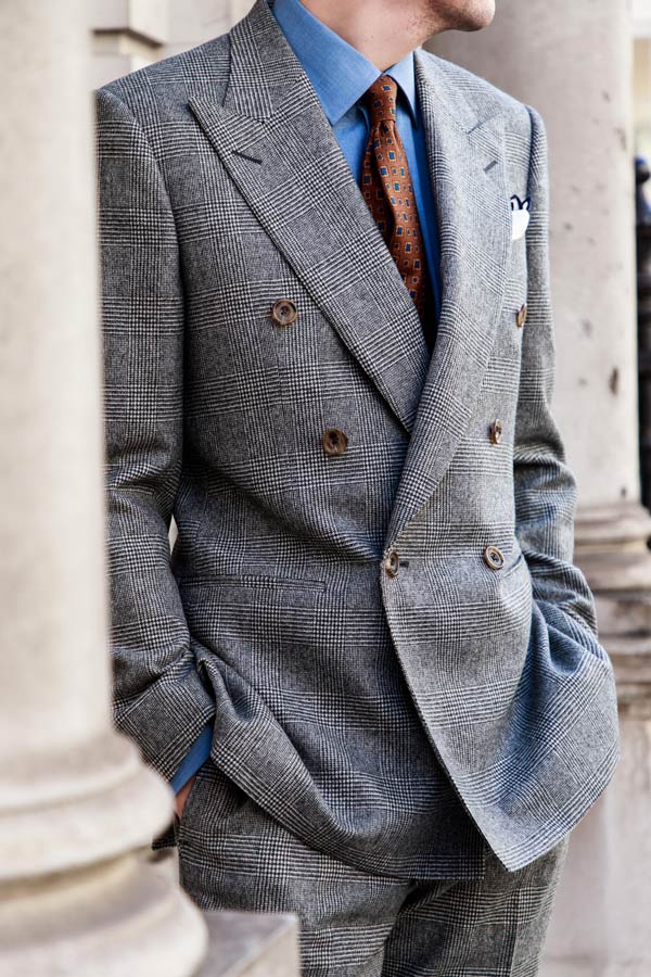 This Prince of Wales check suit pairs well with a denim or white shirt.