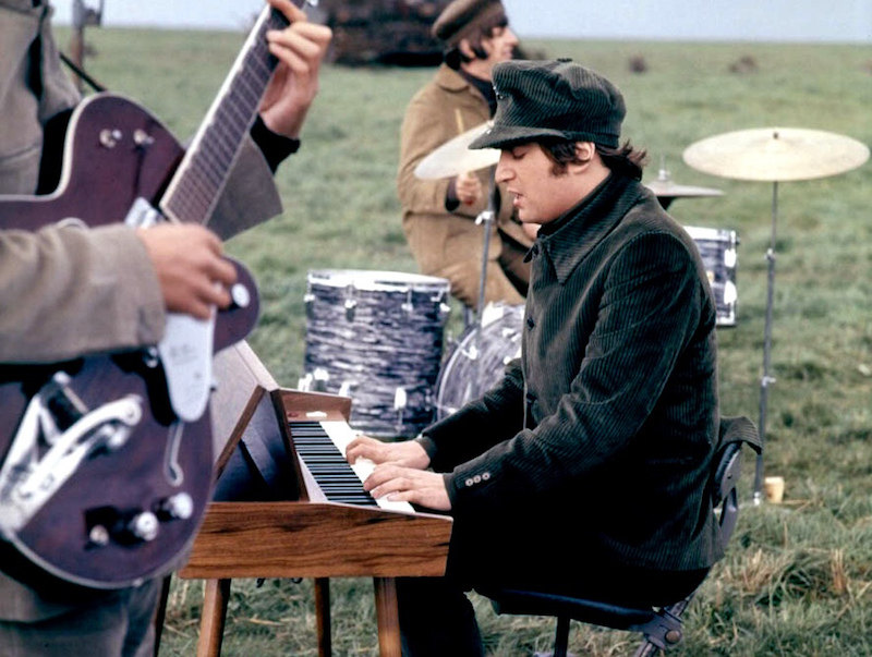 John Lennon in a corduroy suit and hat filming Help! on the Salisbury Plains, 1965. The Beatles were credited with saving the corduroy industry, as their music and style exploded onto the scene and cast such a wide net of appeal.