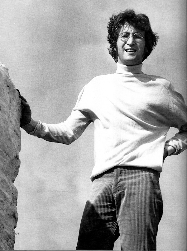 John Lennon takes a casual approach in a turtle-neck and corduroy trousers.