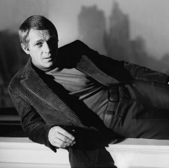 Steve McQueen pairs texture and tone in a corduroy jacket and a ribbed turtle neck.