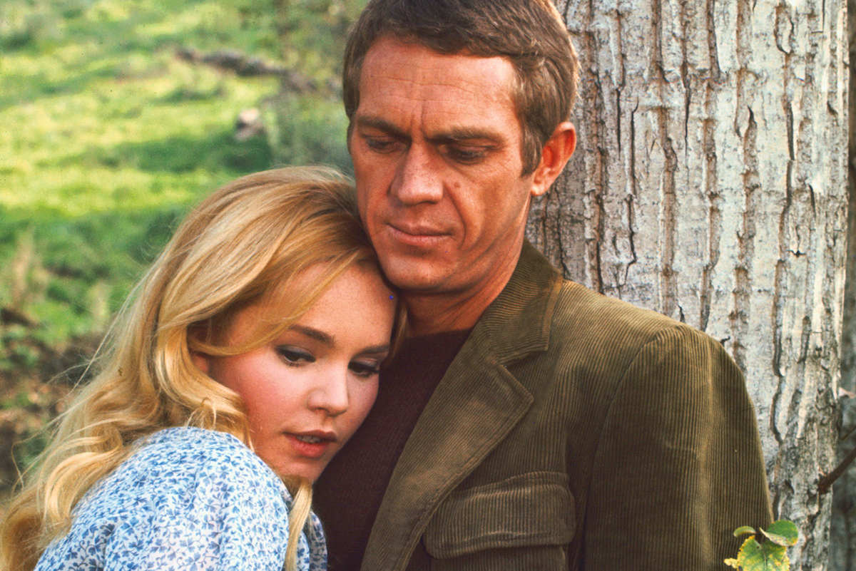 McQueen wears an olive corduroy jacket on set for Soldier in the Rain, with co-star Tuesday Weld, 1963.