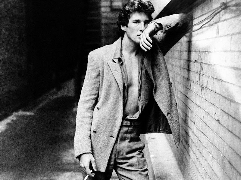 Armani was one of the first to see heavily structured clothes as constricting and began to break the boundaries between accepted formal and casualwear, as seen here on Richard Gere in American Gigolo, 1980.