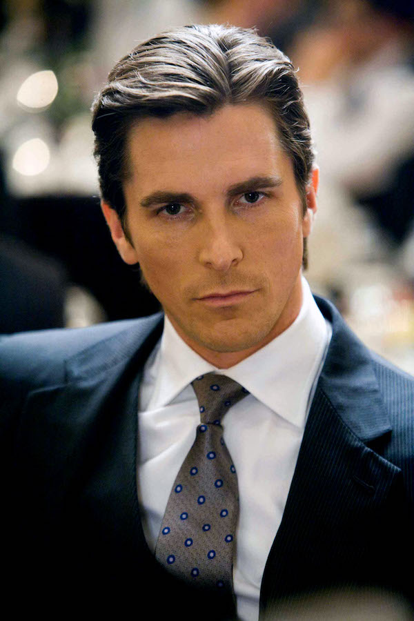 Christian Bale was dressed by Armani to play the role of Bruce Wayne in Batman: The Dark Knight, 2008. Photo by AF archive/Alamy.