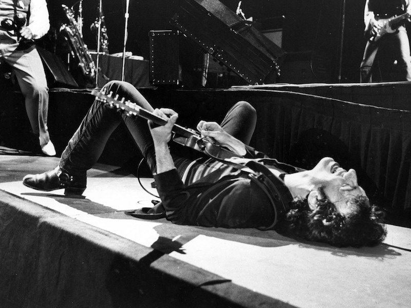 The rock and roll icon on stage playing his guitar on his back during a 1979 Los Angeles concert. Photograph by George Rose/Getty Images.