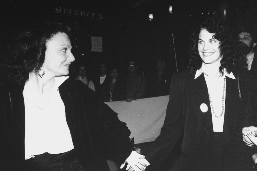 Fashion designer Diane Von Furstenberg and motion picture producer Sherry Lansing holding hands at the 25th anniversary party of Elaine's restaurant. Photo by Robin Platzer/Twin Images/The LIFE Images Collection/Getty Images.